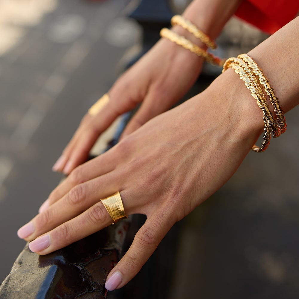 Delicately handmade to fit any wrist size, the Otto Twisted Gold bangle is designed to relfect the texture of a twisted rope. This sustainable open cuff looks great worn alone or stacked.