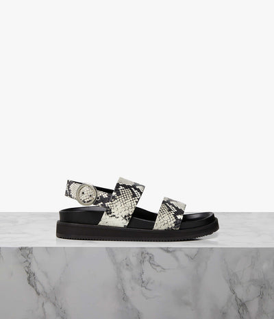 An elevated update to the sports slide, the Zephyr sandal is an everyday design classic with an athleisure twist. Set on a sturdy rubber sole, the ergonomic leather-covered footbed provides ample support for a day on your feet. Finished with a double-front strap to hold the foot in place, a cupped footbed design prevents sliding for a more conformed fit. Wear the Zephyr in the city now and pack it for holidays later.