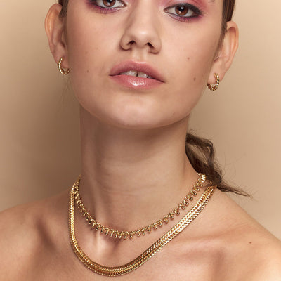 The vintage inspired Anna Snake Chain Gold Necklace is a&nbsp;modern classic that sits flat on the neck and is the ideal for layering.