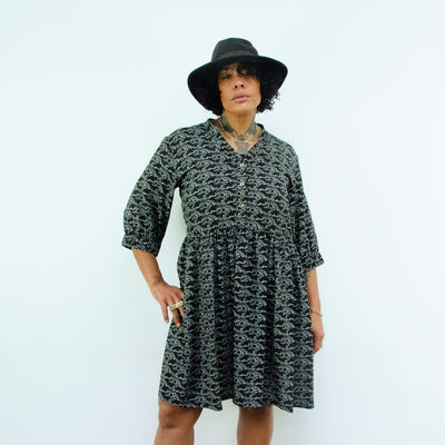 woman wearing hat in Sara - Monochrome Linear Print Skater Style Shirt Dress