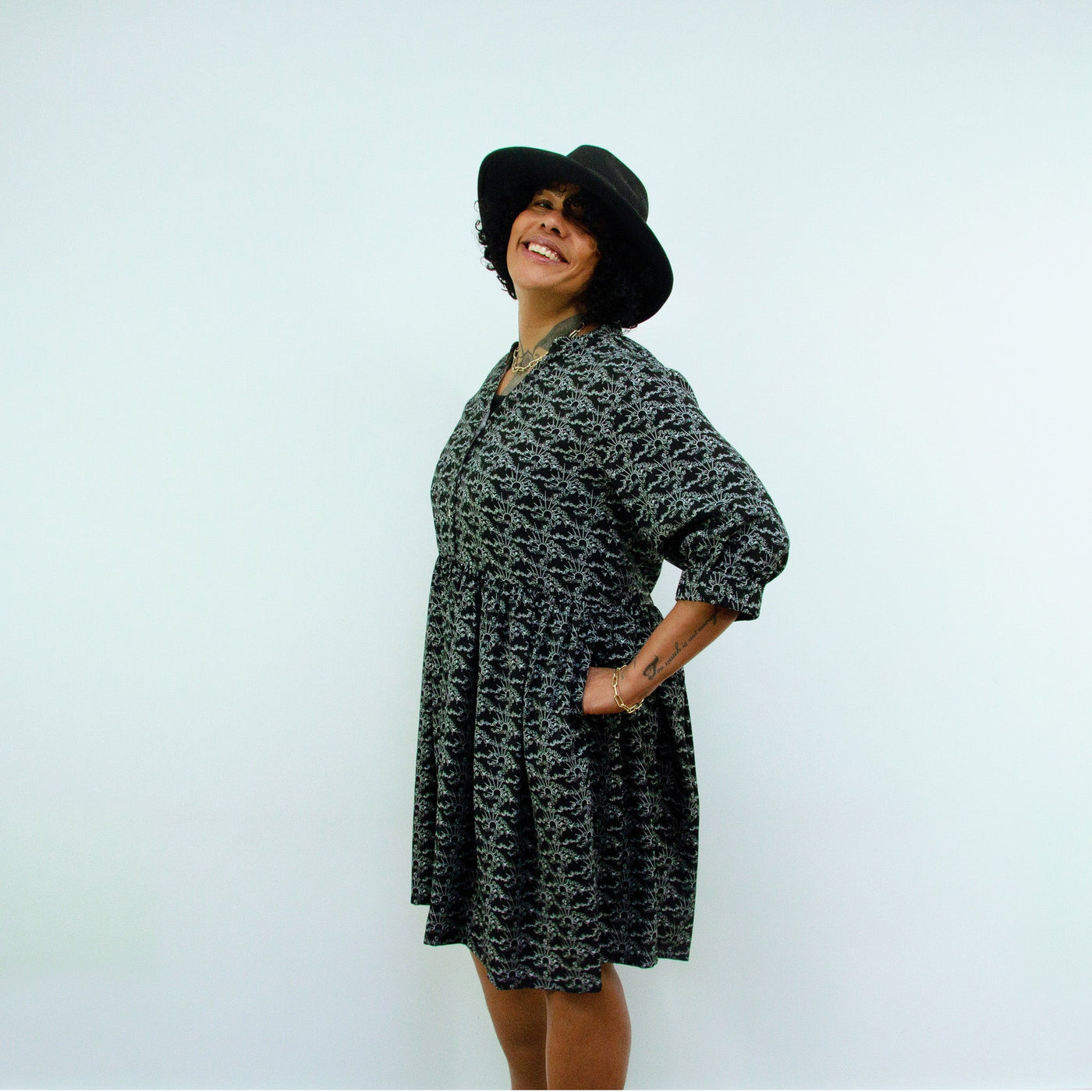 woman wearing hat in Sara - Monochrome Linear Print Skater Style Shirt Dress