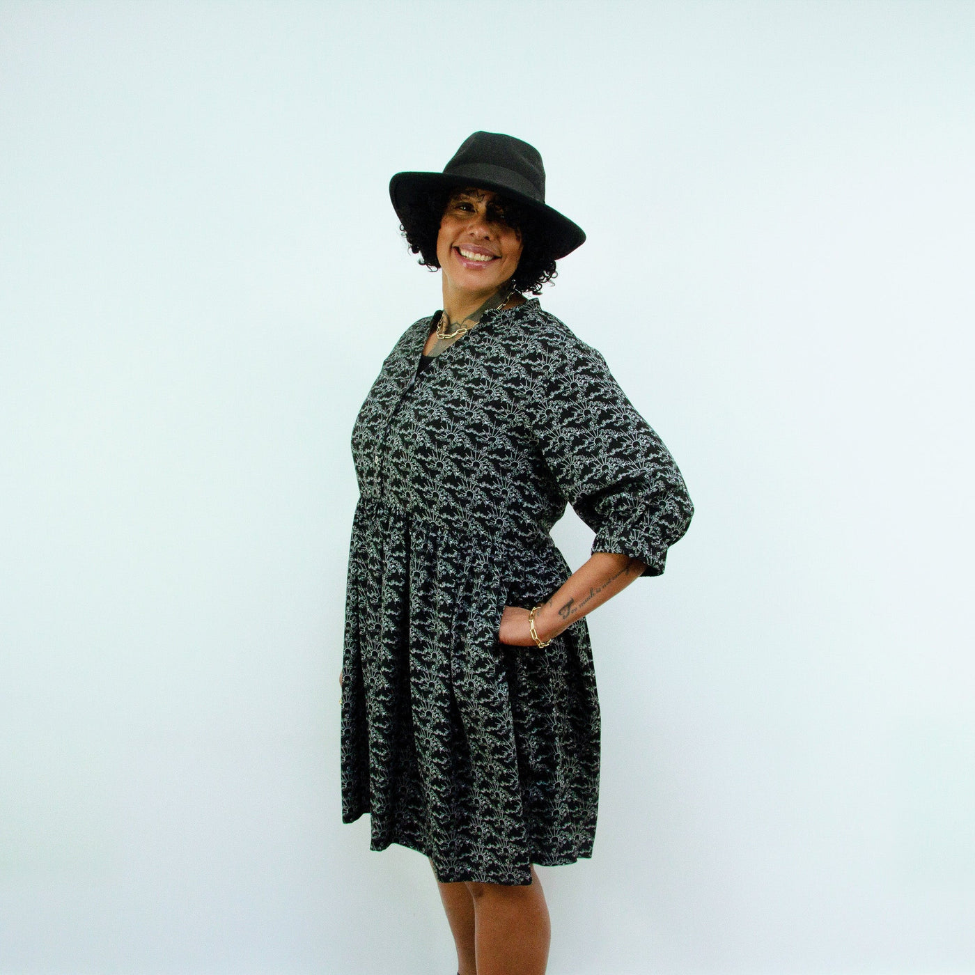 woman wearing hat in Sara - Monochrome Linear Print Skater Style Shirt Dress